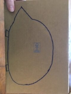 Draw a hedgehog shape on a piece of cardboard